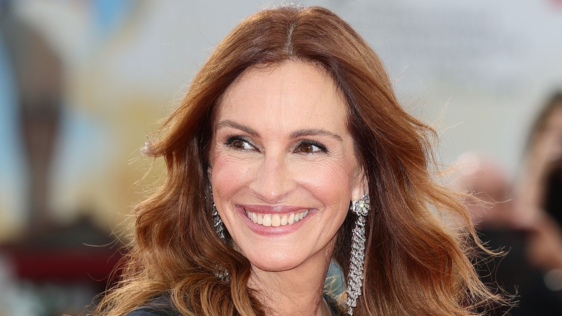 Julia Roberts smiling in red carpet black dress