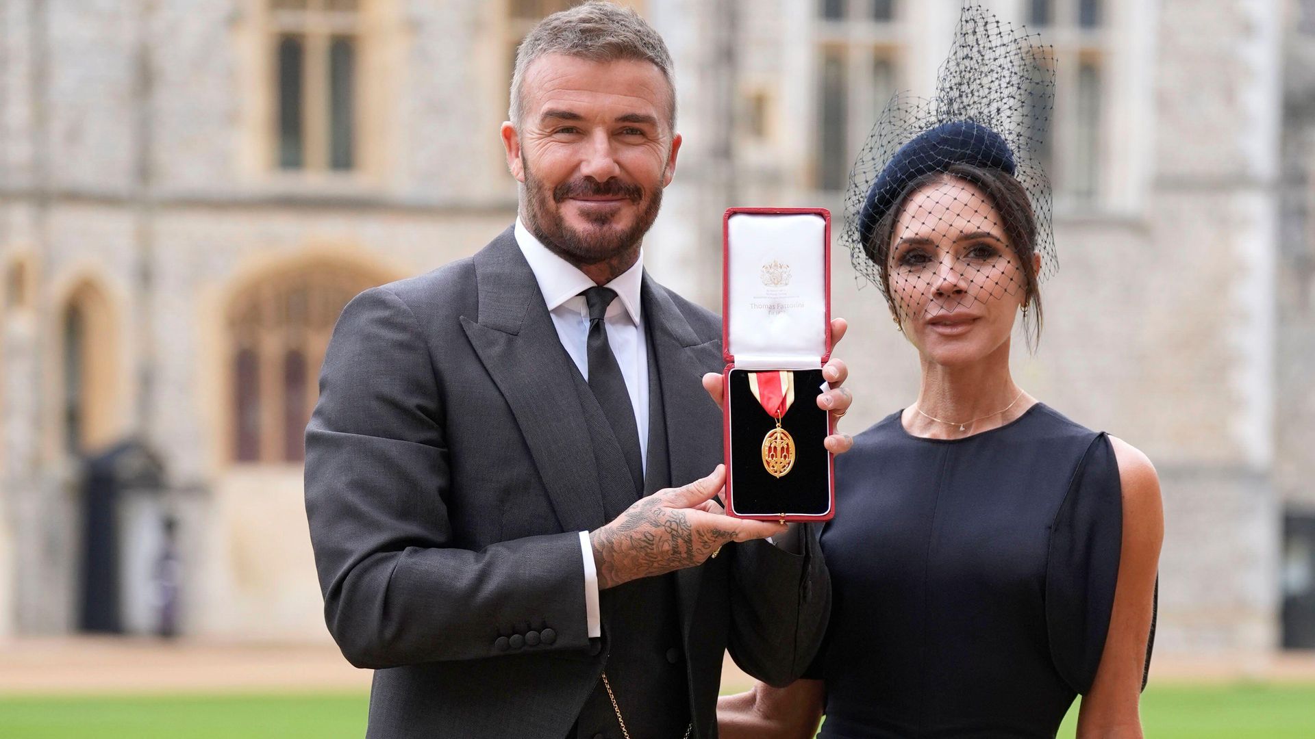 Sir David Beckham, with his wife Lady Victoria, after he was made a Knight Bachelor at an investiture ceremony at Windsor Castle, Berkshire