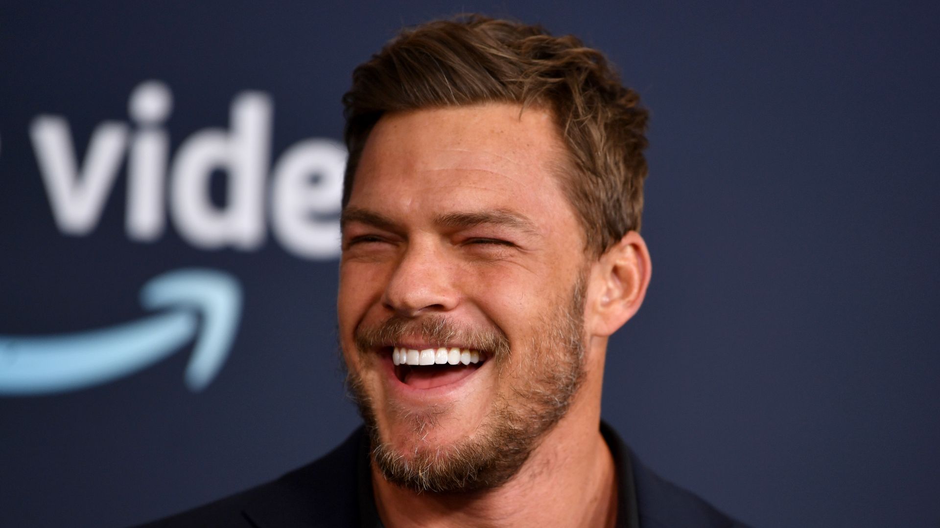 alan ritchson smiling