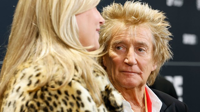 Rod Stewart and Penny Lancaster looking sad 