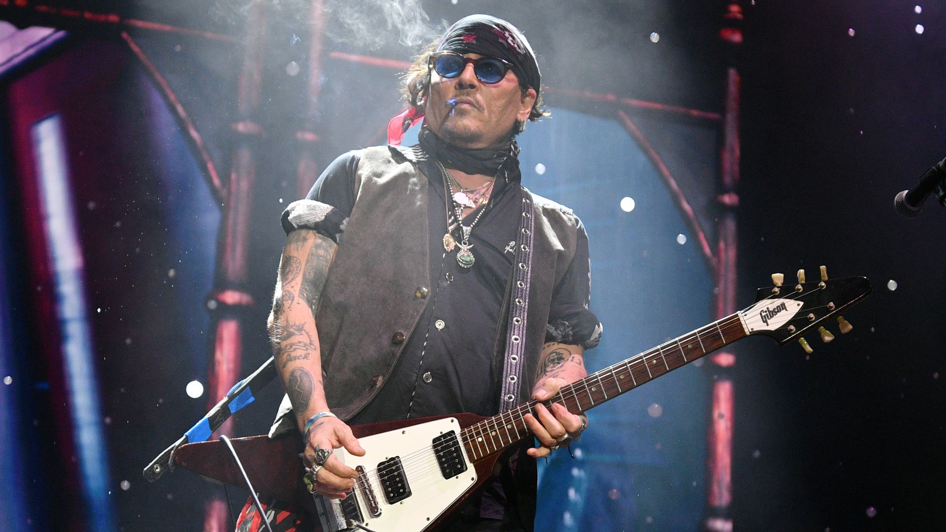 Johnny Depp performs with Alice Cooper during a concert at The O2 Arena on July 25, 2025 in London, England