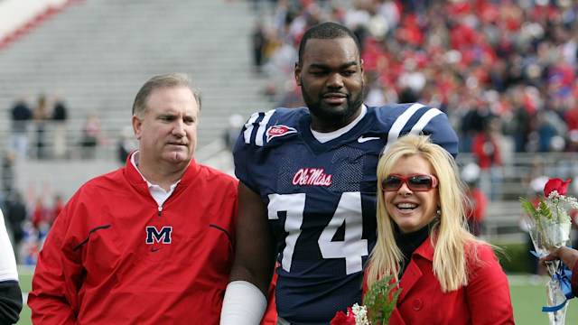 Michael Oher #74 of the Ole Miss Rebels stands with his family during senior ceremonies prior to a game against the Mississippi State Bulldogs at Vaught-Hemingway Stadium on November 28, 2008 in Oxford, Mississippi