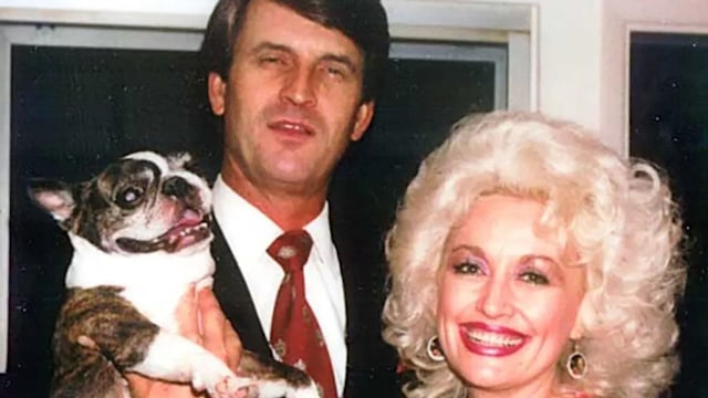 dolly parton and carl dean throwback holding dog