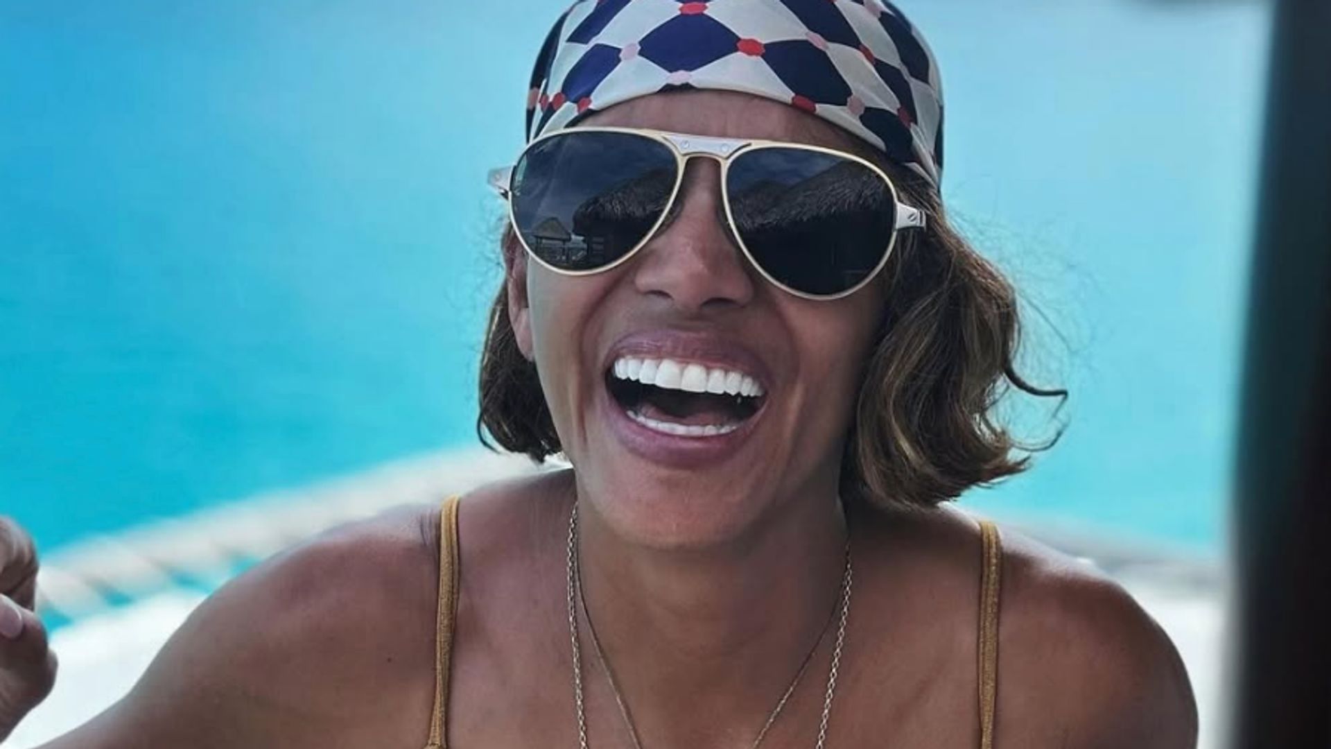 Halle Berry wearing a gold bikini on her 59th birthday vacation 