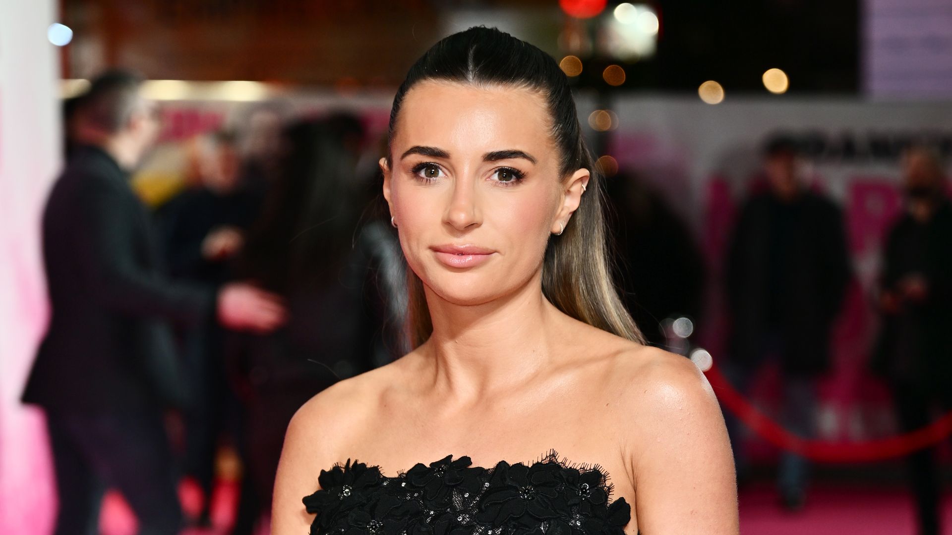 Dani Dyer wearing black strapless dress