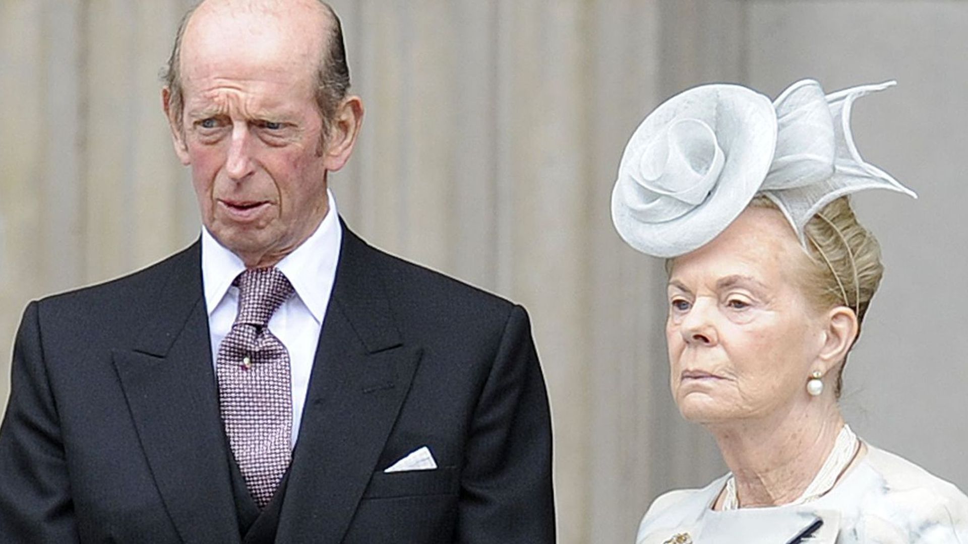 Duke of Kent in a tailcoat linking arms with the Duchess of Kent