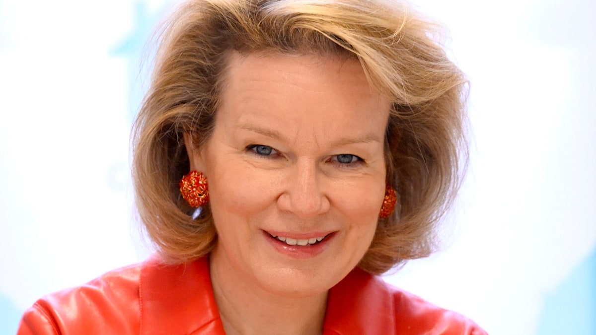 Queen Mathilde surprises in waist-cinching red leather jacket for sensitive solo outing