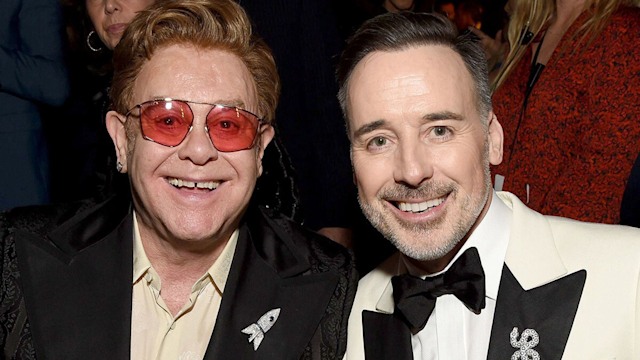 Elton John and husband David Furnish smiling