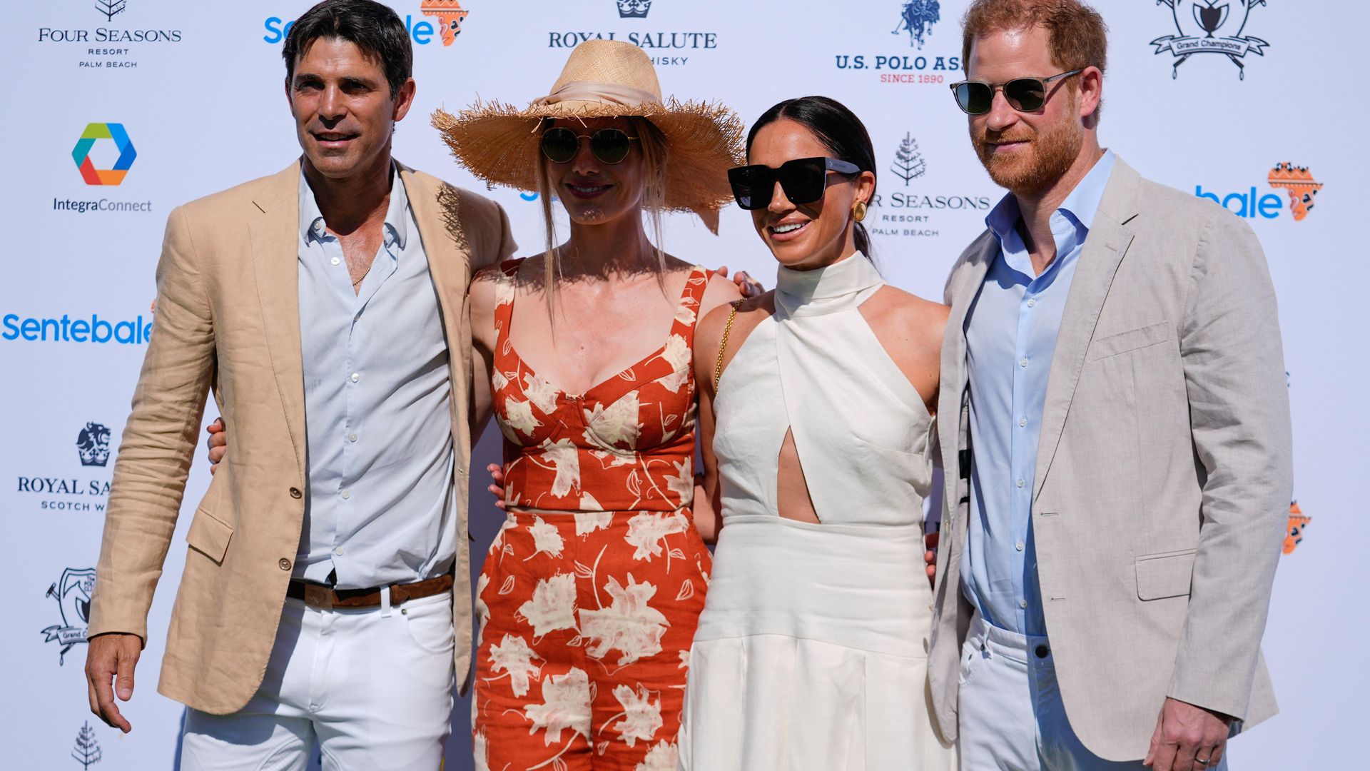 Prince Harry and Meghan Markle pose for photos with Argentine professional polo player Ignacio "Nacho" Figueras, and his wife Delfina Blaquier 