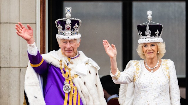 King Charles and Queen Camilla waving from palace balcony on coronation day