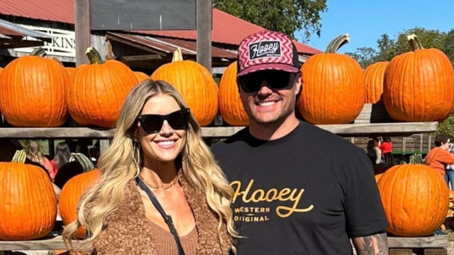Photo posted by Christina Hall to her Instagram Stories October 2023 where she is posing next to her husband Josh Hall while at a pumpkin patch in Tennessee.