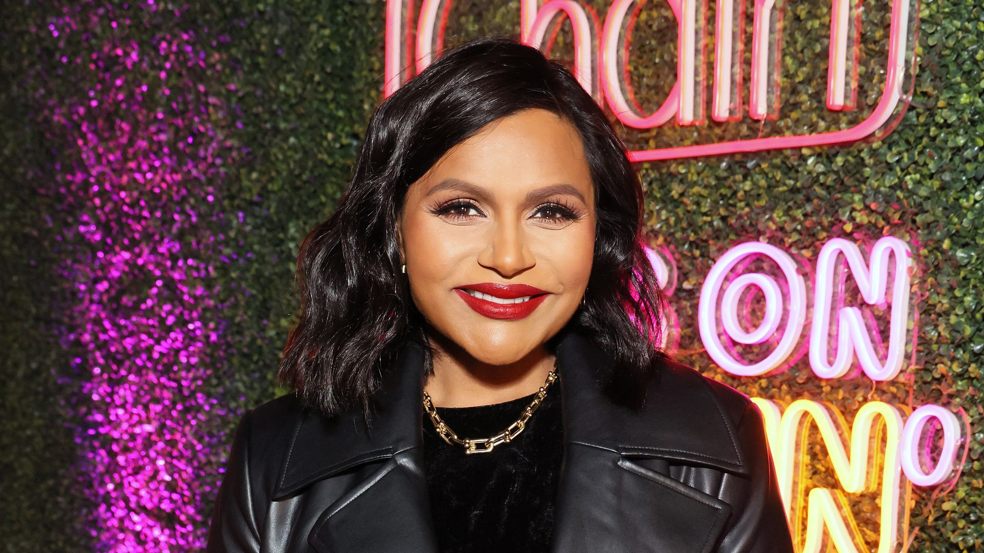 Mindy Kaling in a black leather coat
