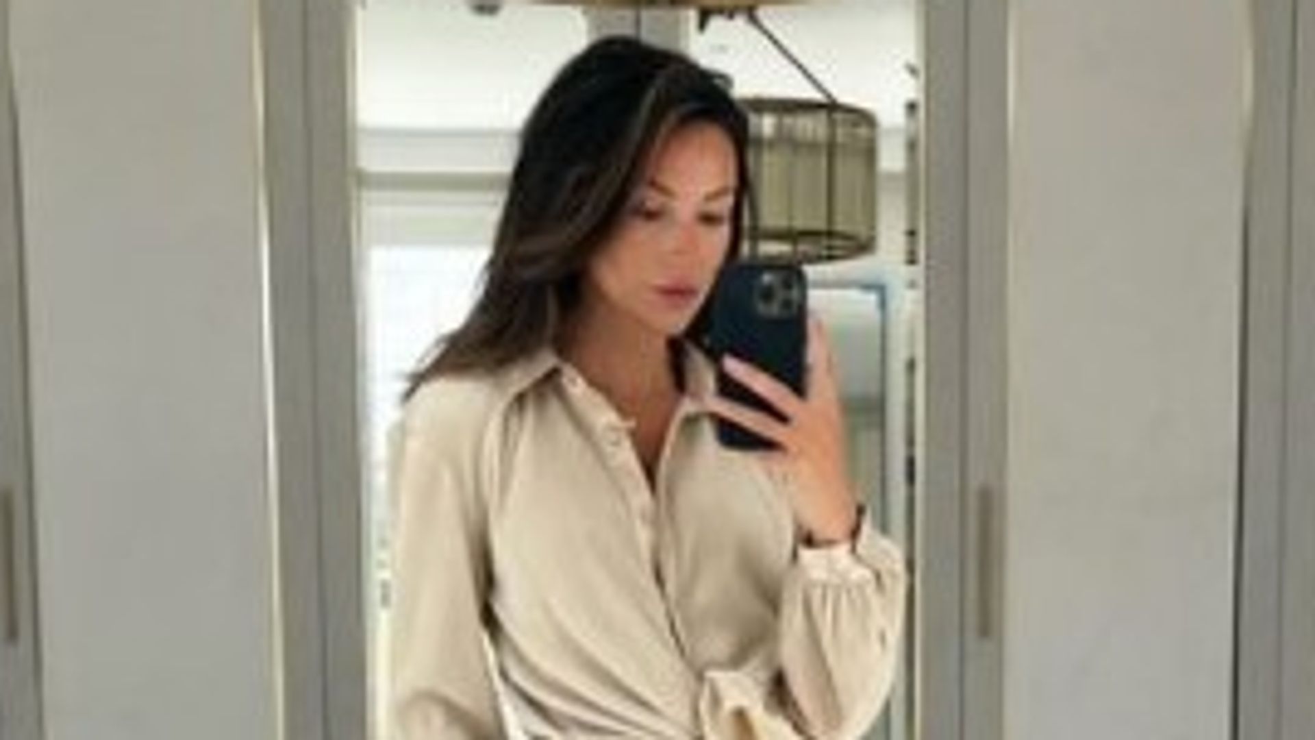 Michelle Keegan in Essex home dressing room taking selfie wearing beige coord