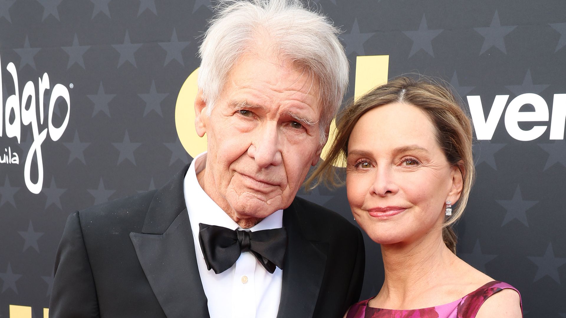 harrison ford and calista flockhart in tix and purple dress critics choice awards 2024