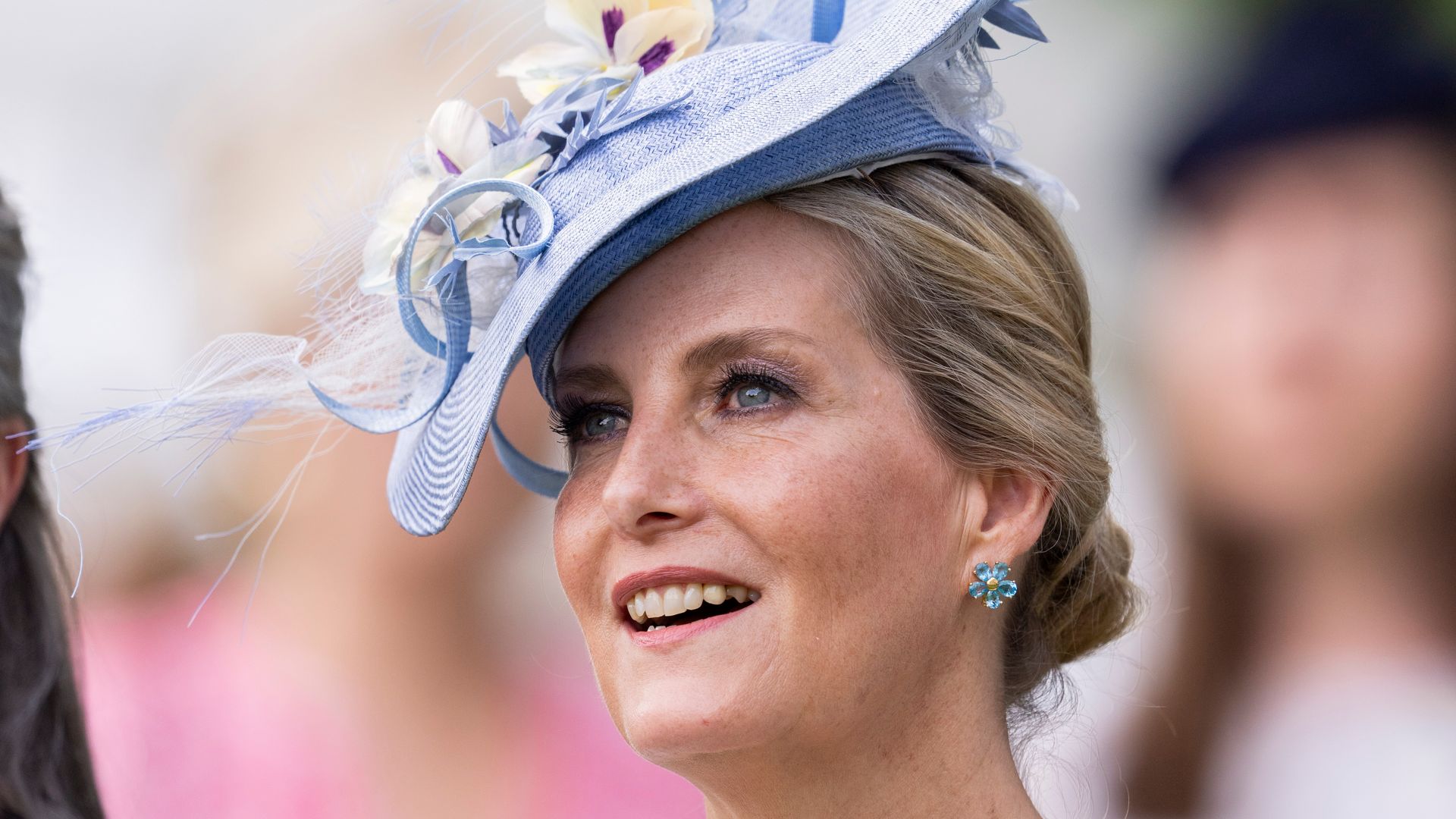 Duchess Sophie smiling in a blue hat at Royal Ascot in 2023