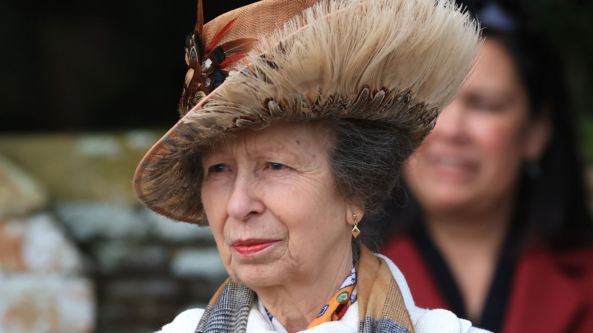 Princess Anne in a hat and scarf on Christmas Day