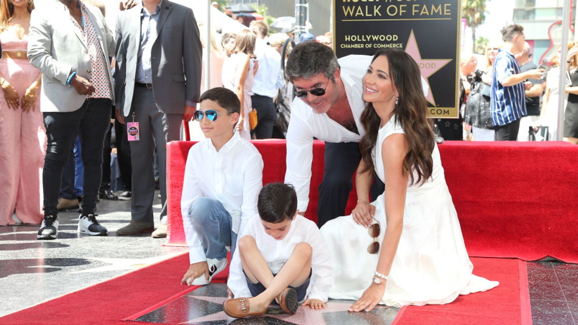 Simon Cowell and Lauren Silverman, Adam Silverman and Eric Cowell on the Hollywood walk of fame. 