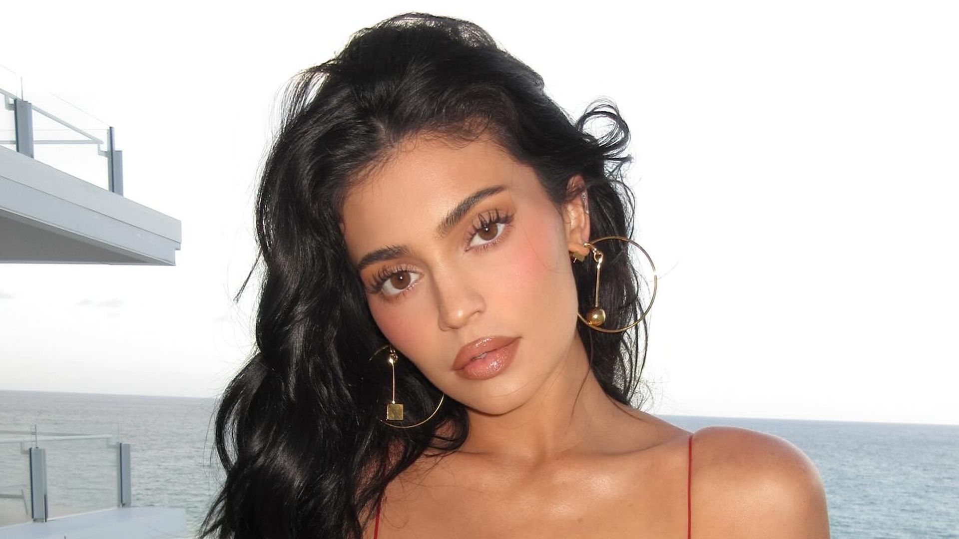 Kylie Jenner poses in a red mini dress