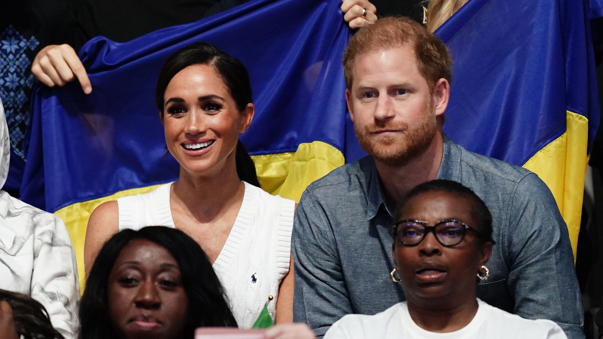 The Duke and Duchess of Sussex watch the sitting volleyball competition on field one at the Merkur Spiel-Arena during the Invictus Games in Dusseldorf, Germany. Picture date: Thursday September 14, 2023. (Photo by Jordan Pettitt/PA Images via Getty Images)