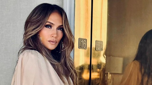 Jennifer Lopez poses for a pictures in a sand-toned Chloé outfit