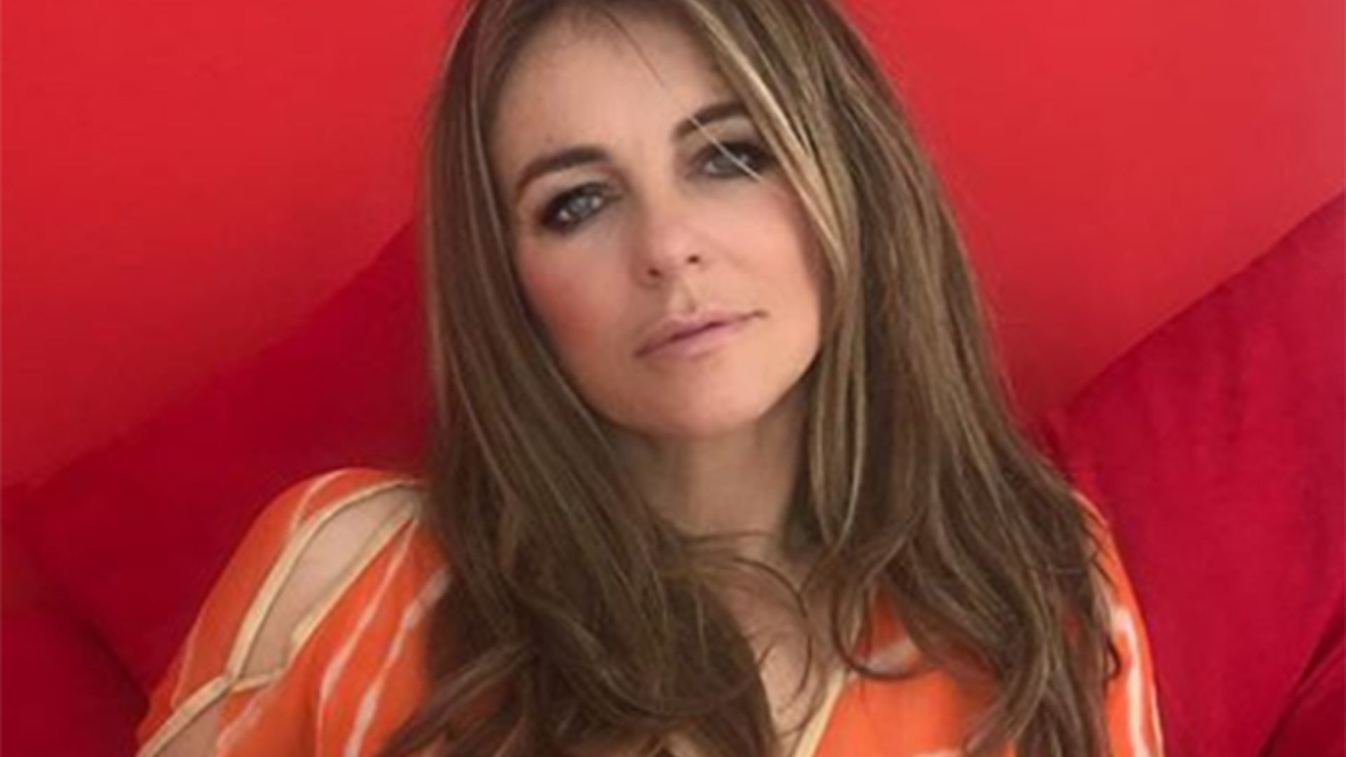 Elizabeth Hurley posts daring photo in glamorous orange kaftan | HELLO!