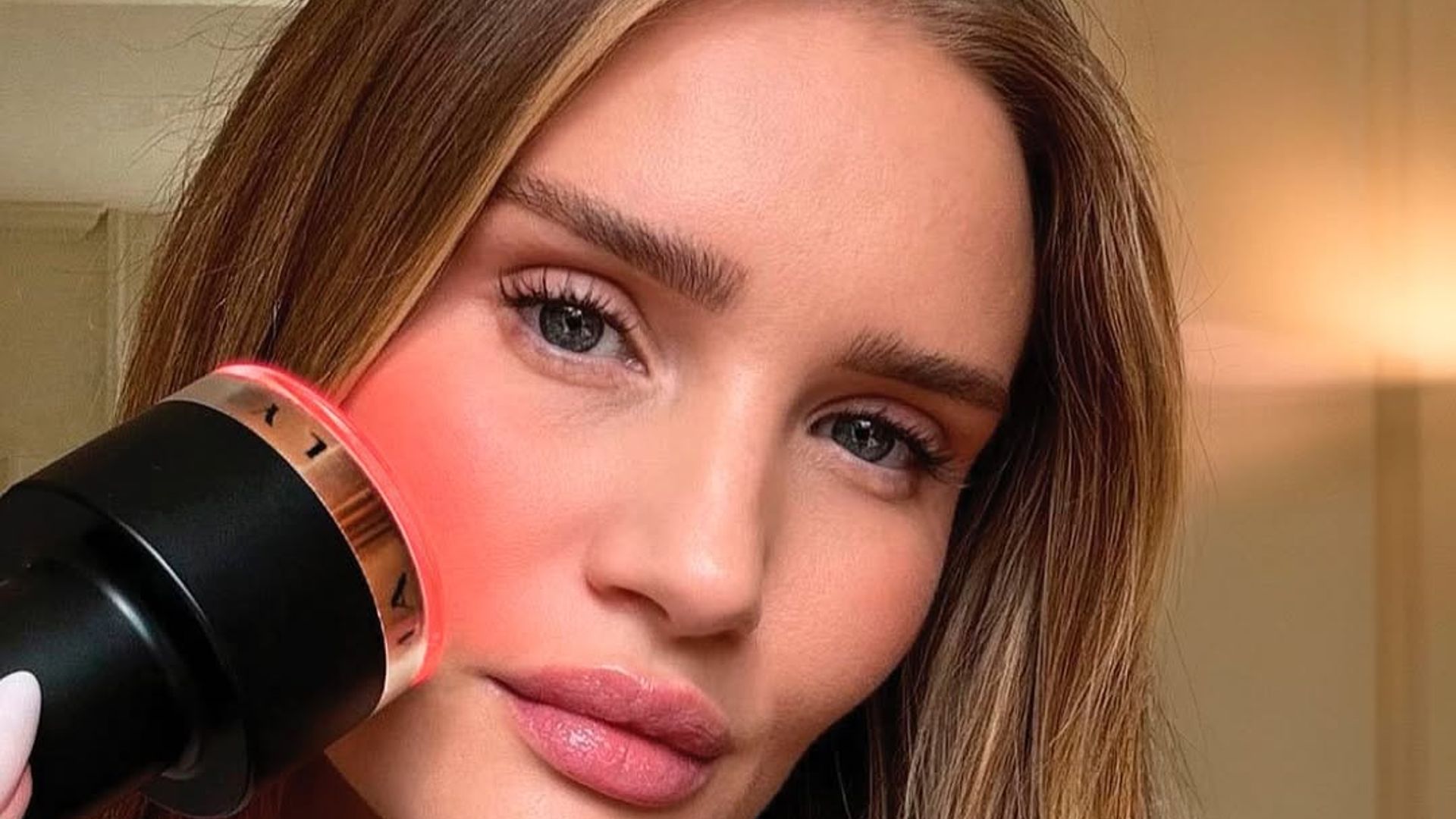 Rosie Huntington-Whiteley using Lyma Laser Pro on her face
