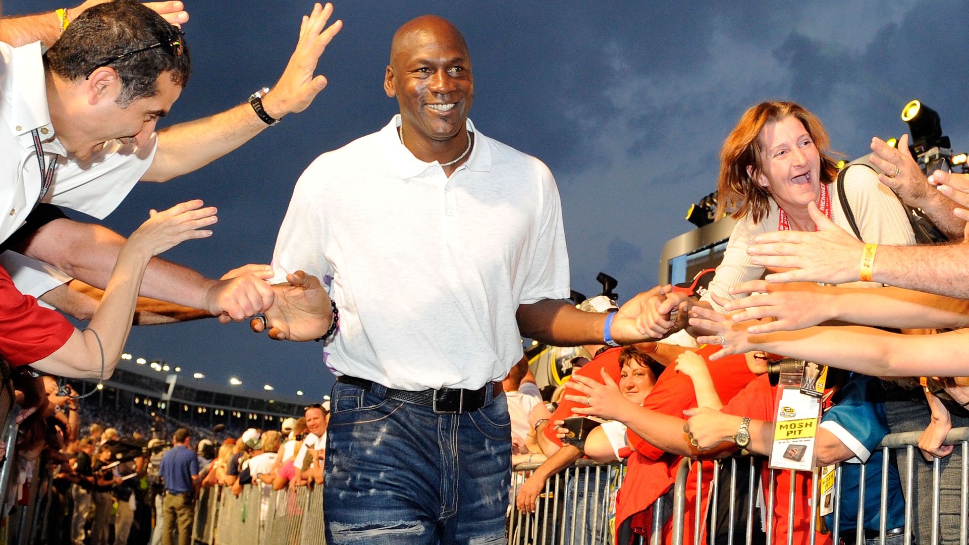 Chicago Bulls star Michael Jordan high-fives the crowd during pre-race ceremonies prior to the start of the NASCAR Sprint All-Star Race at Charlotte Motor Speedway on May 22, 2010 in Concord, North Carolina