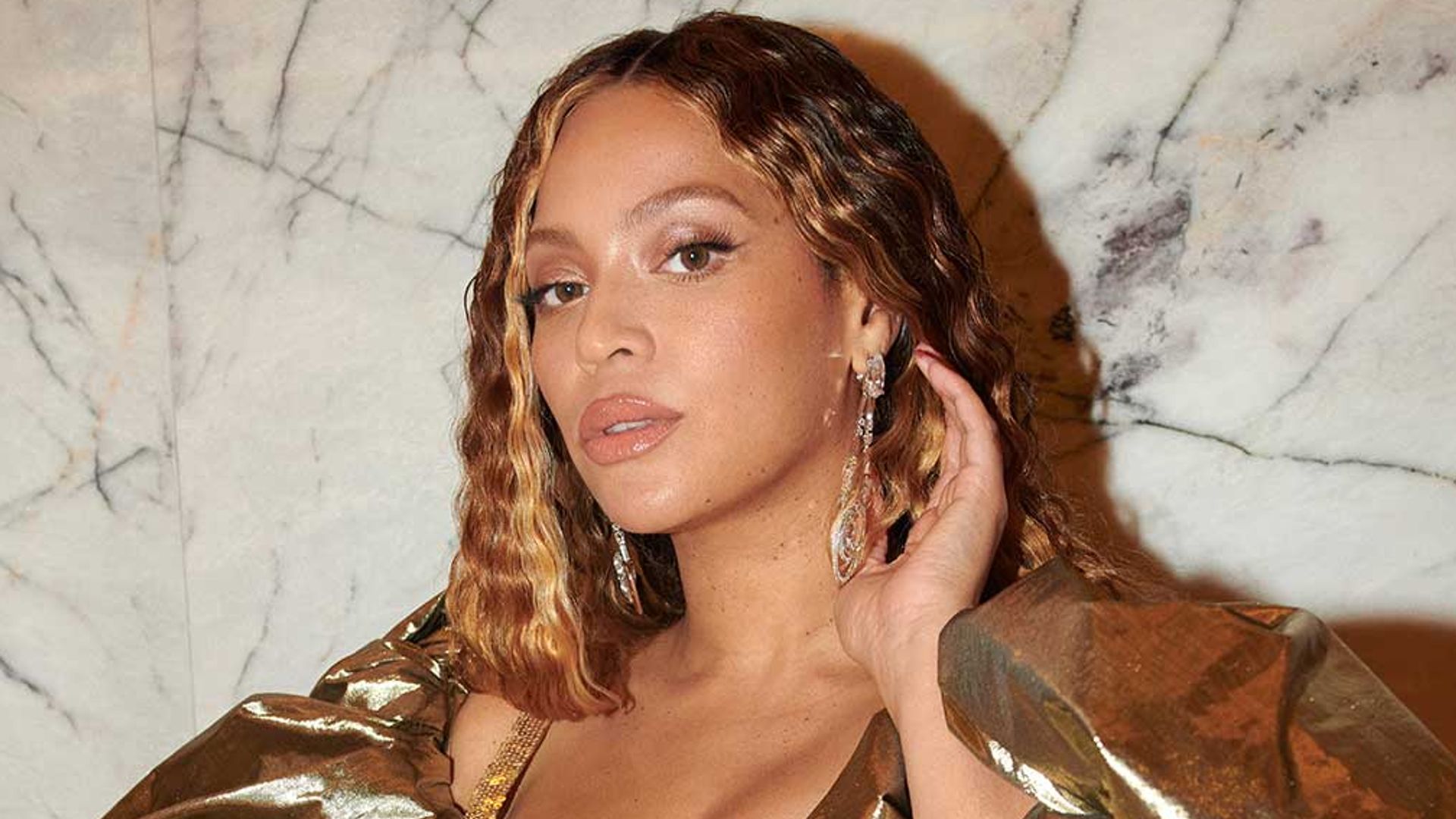 Beyonce wearing metallic gold gown
