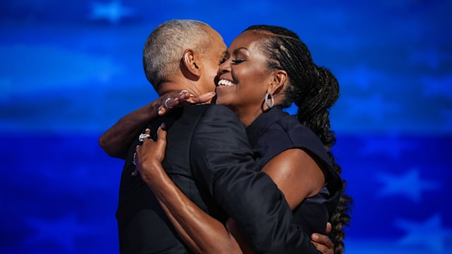 Michelle Obama hugging Barack Obama 