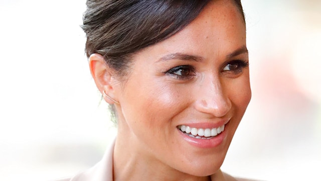 Meghan Markle, Duchess of Sussex visits The National Theatre on January 30, 2019 in London, England, wearing pastel pink.