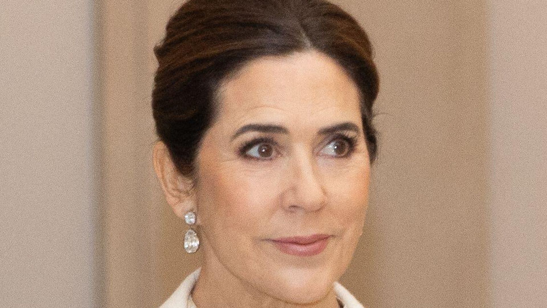 Queen Mary channels Snow Queen in cinched gold gown