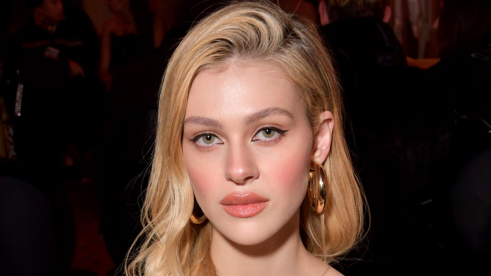 Nicola Peltz in the front row (Photo by Swan Gallet/WWD/Penske Media via Getty Images)