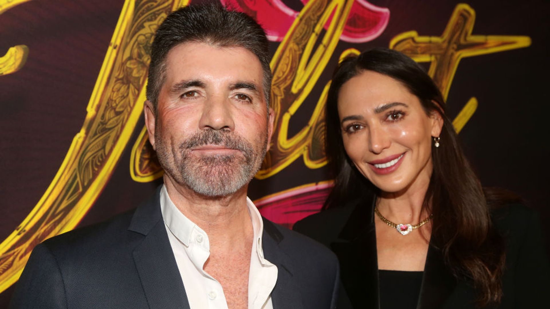 Simon Cowell and Lauren Silverman pose at the opening night of the new musical "& Juliet" on Broadway at The Stephen Sondheim Theatre on November 17, 2022