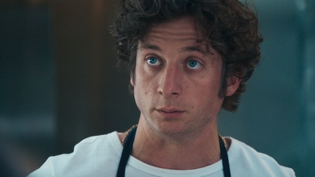 close-up of man in white top
