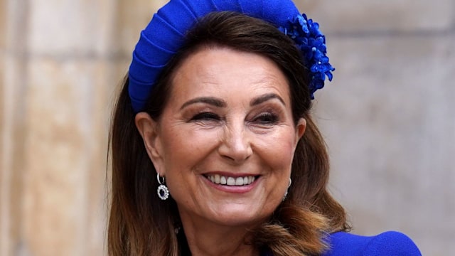Carole smiling in a cobalt blue dress