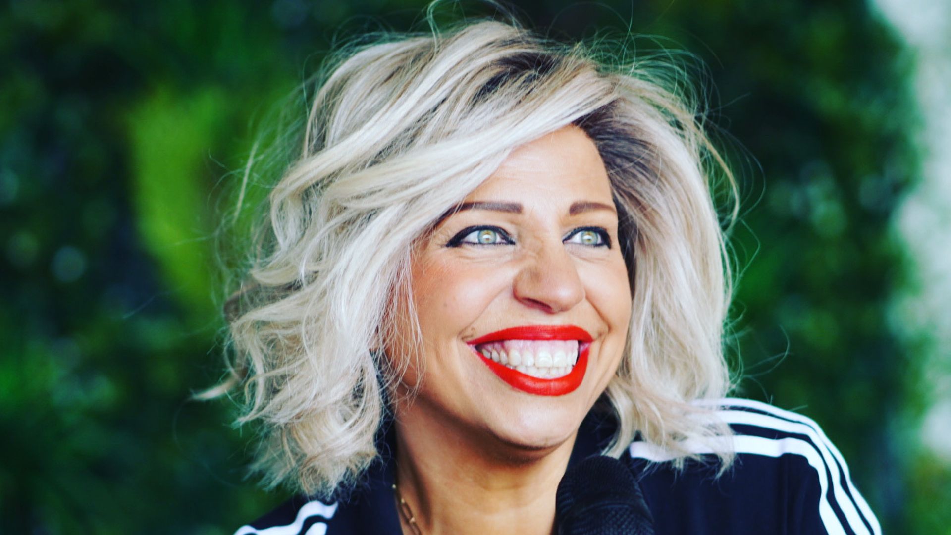 Smiling woman with red lipstick