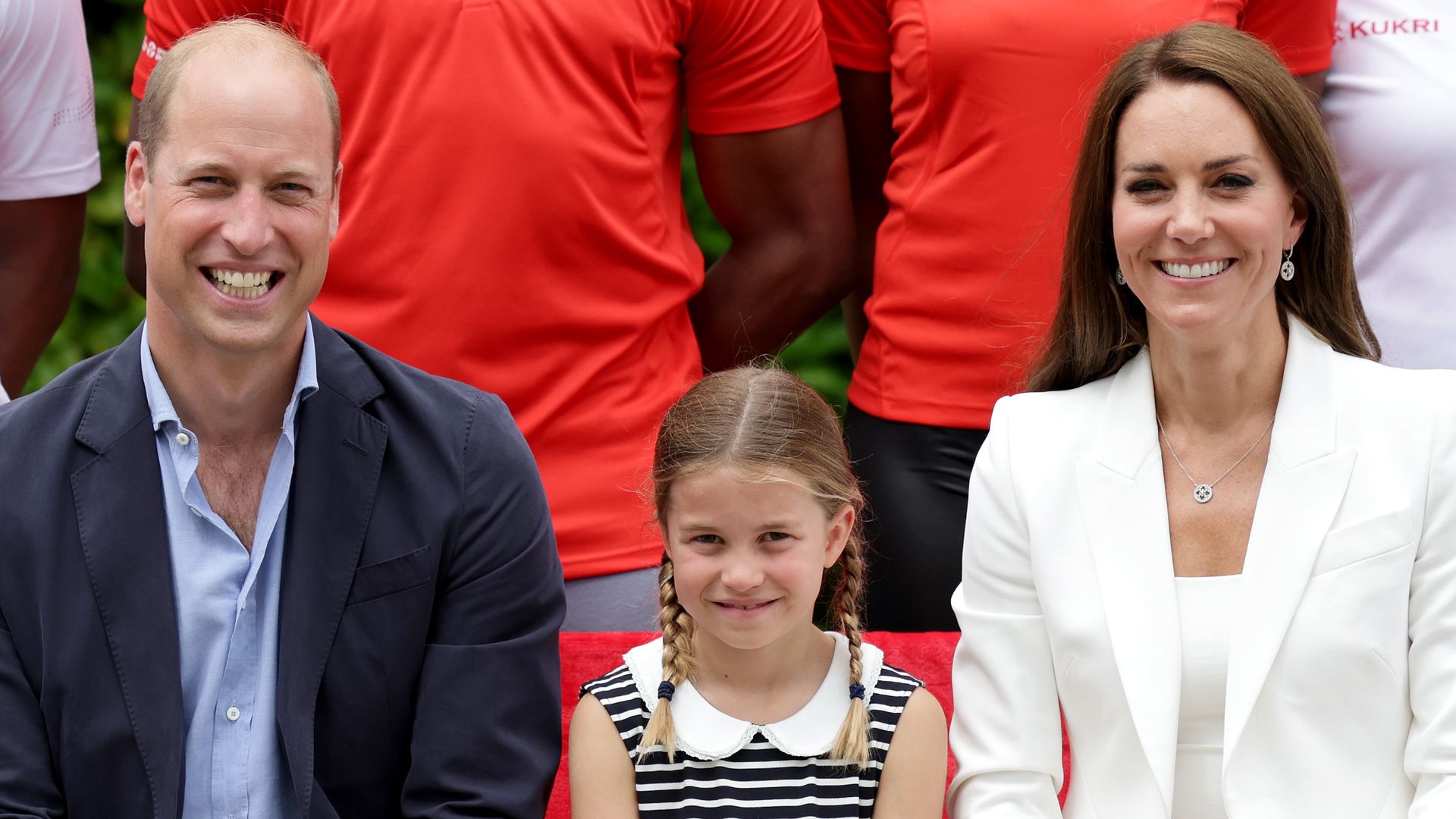  Prince William, Catherine, and Princess Charlotte of Cambridge pose sitting down