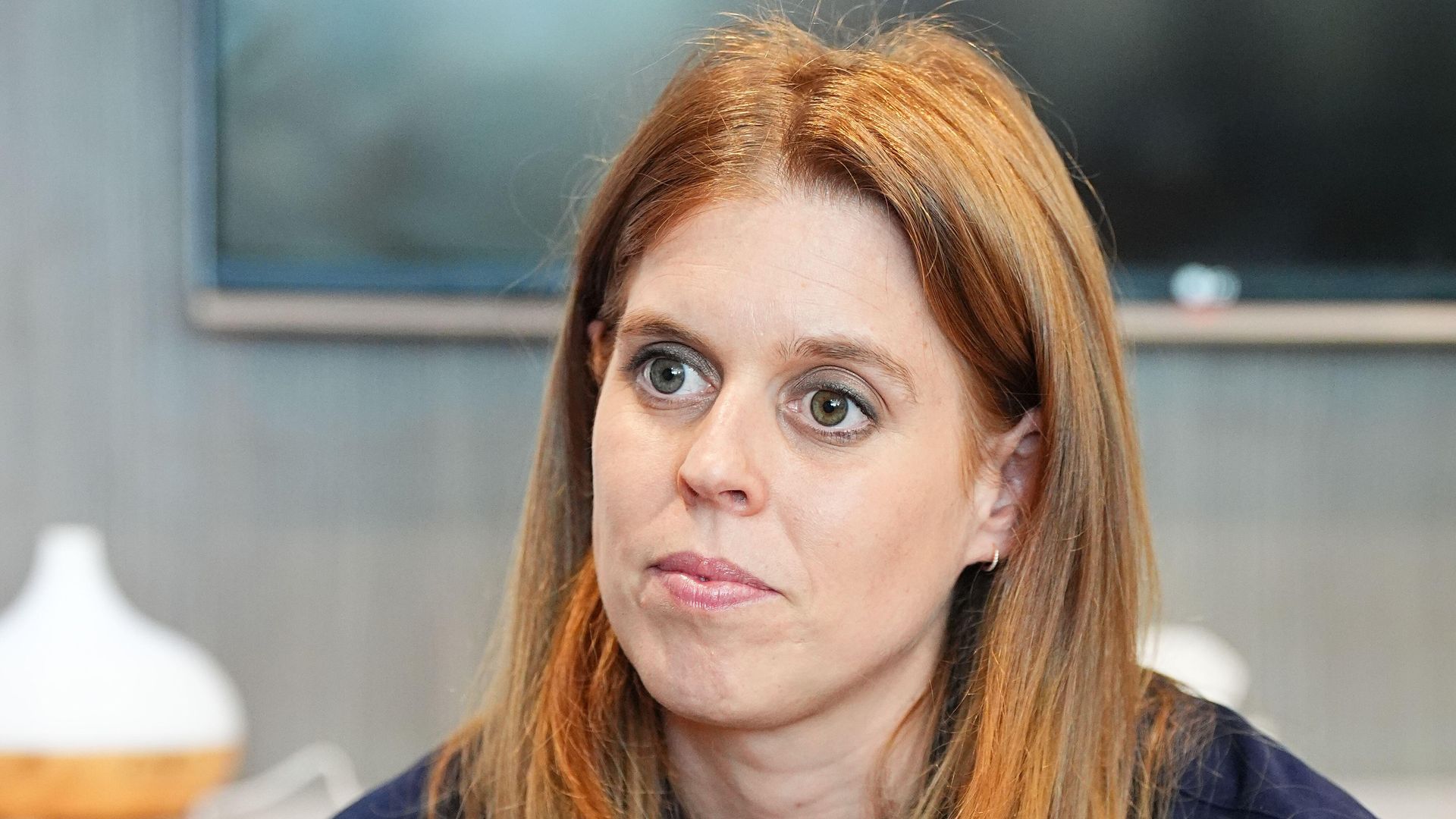 Princess Beatrice in a navy-coloured dress