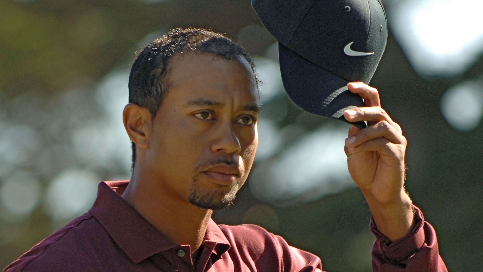 Tiger Woods reacts after beating John Daly in a playoff during the final round of The World Golf Championships 2005 American Express Championship at Harding Park Golf Club in San Francisco