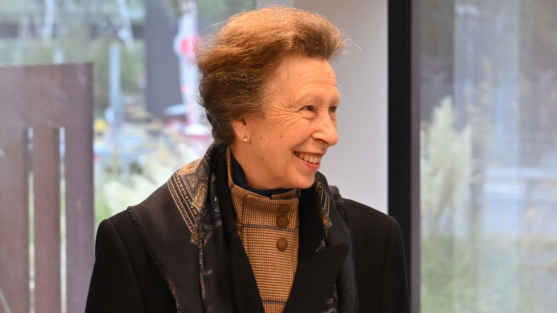 Princess Anne steps out in dad trainers and check flares