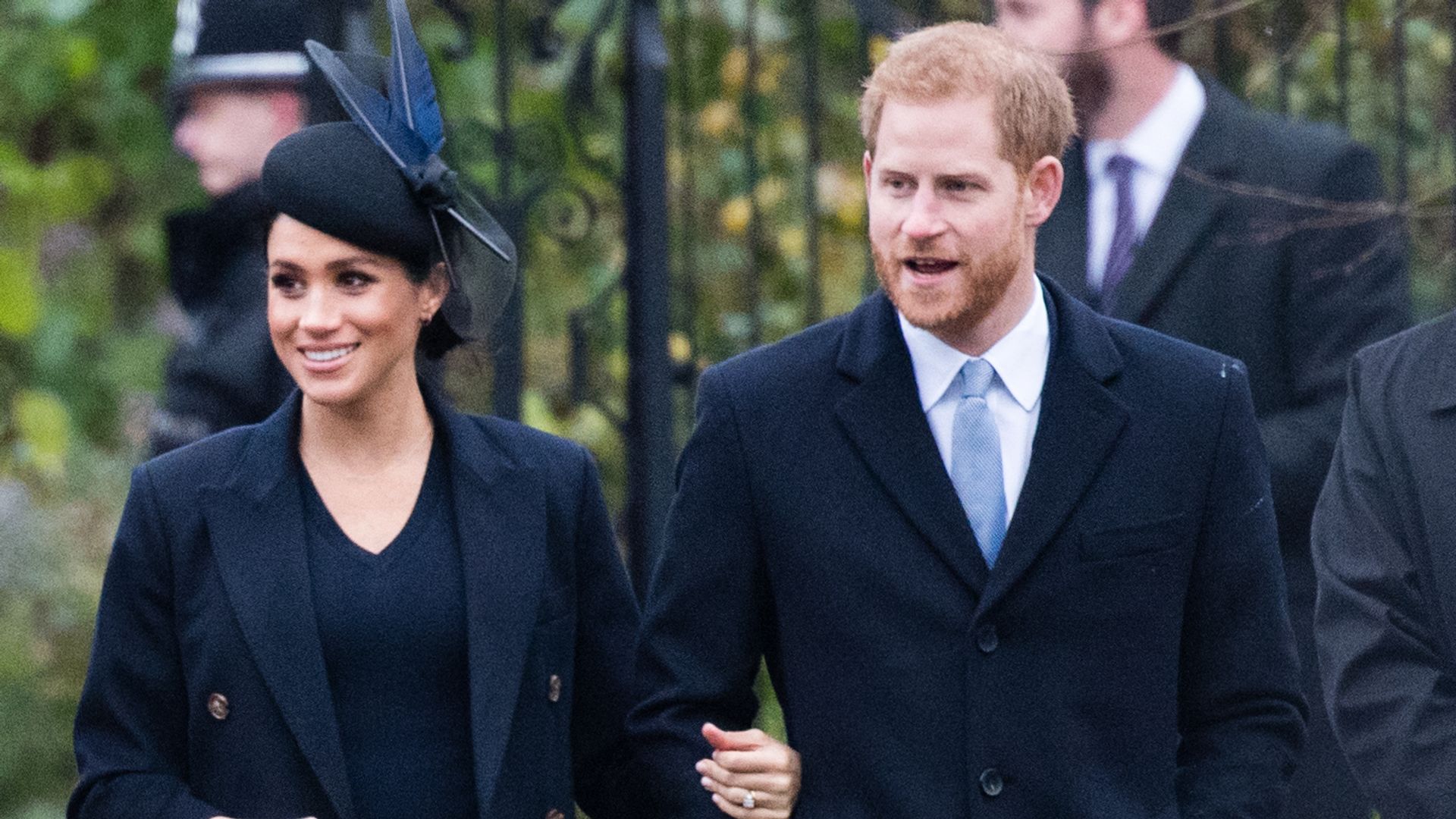 Meghan Markle and Prince Harry Harry walking in black