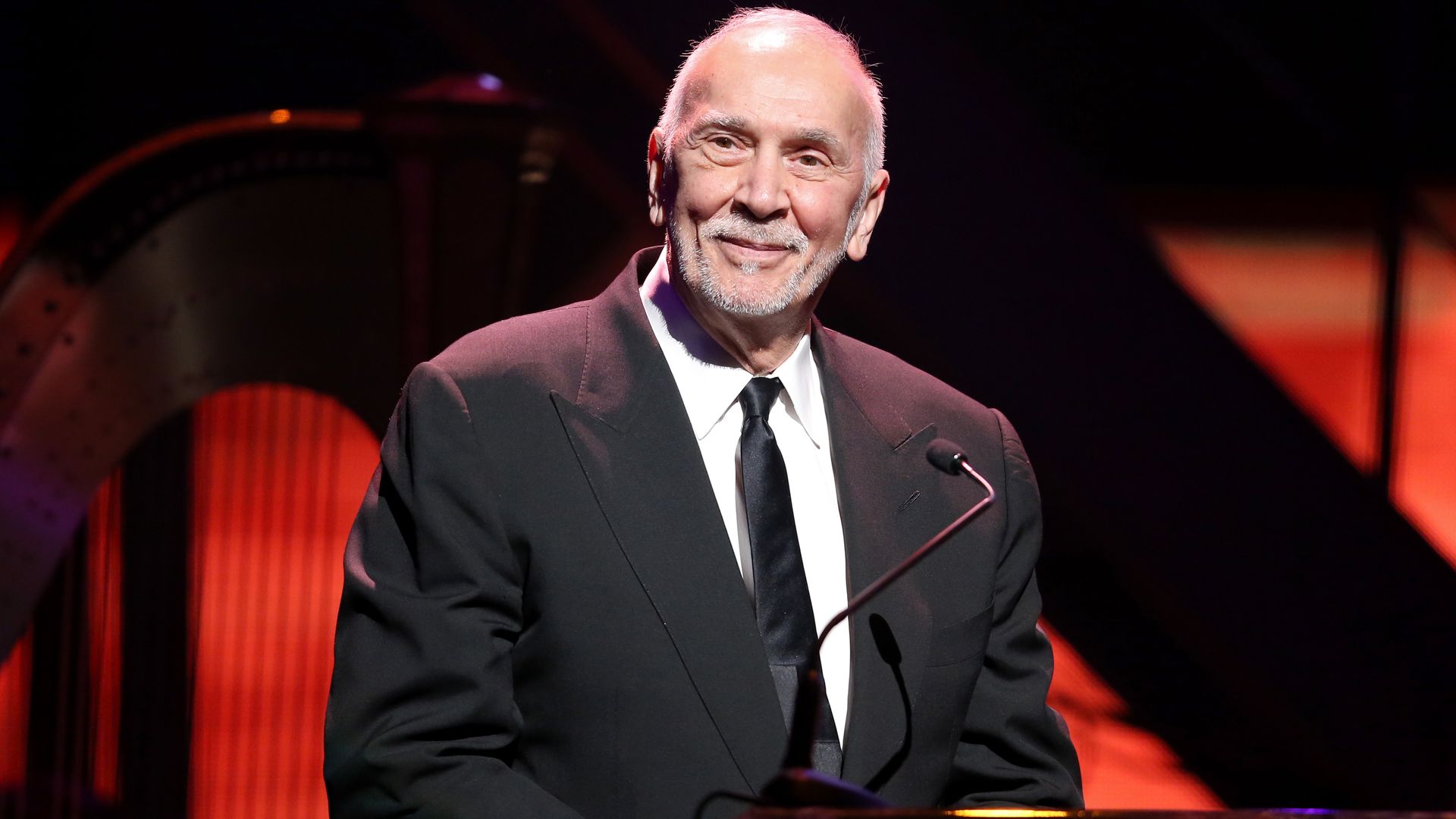 Frank Langella smiling while hosting an award