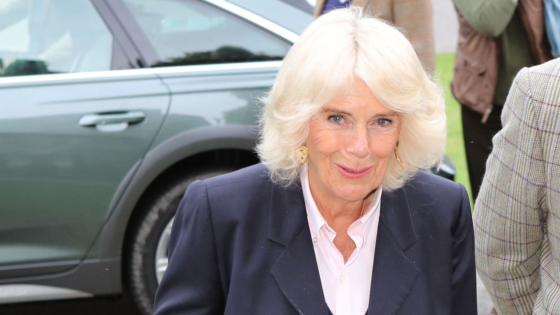 Queen Camilla surprised royal style watchers in skinny jeans and a candy pink blouse