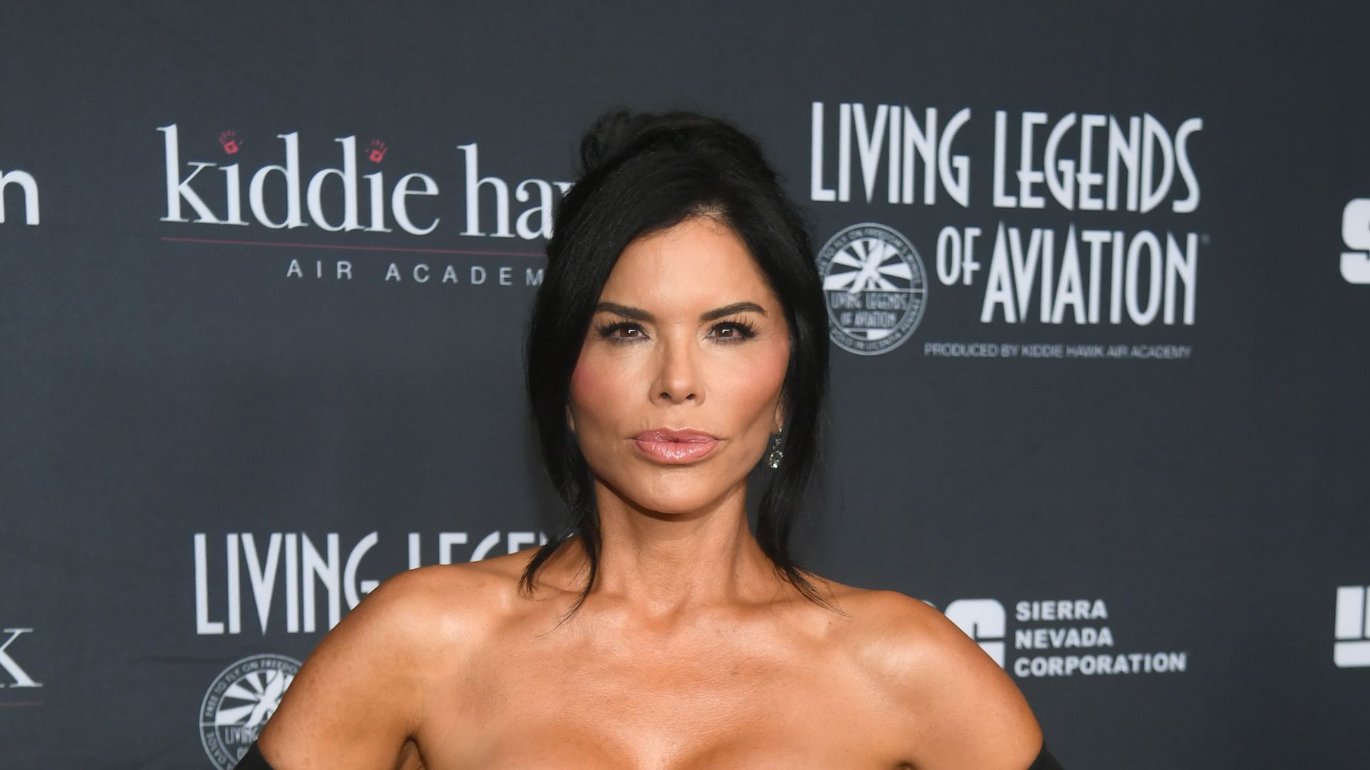 Lauren Sanchez 'thrilled' to be honored alongside Prince Harry as she wows in a slinky black Balenciaga gown