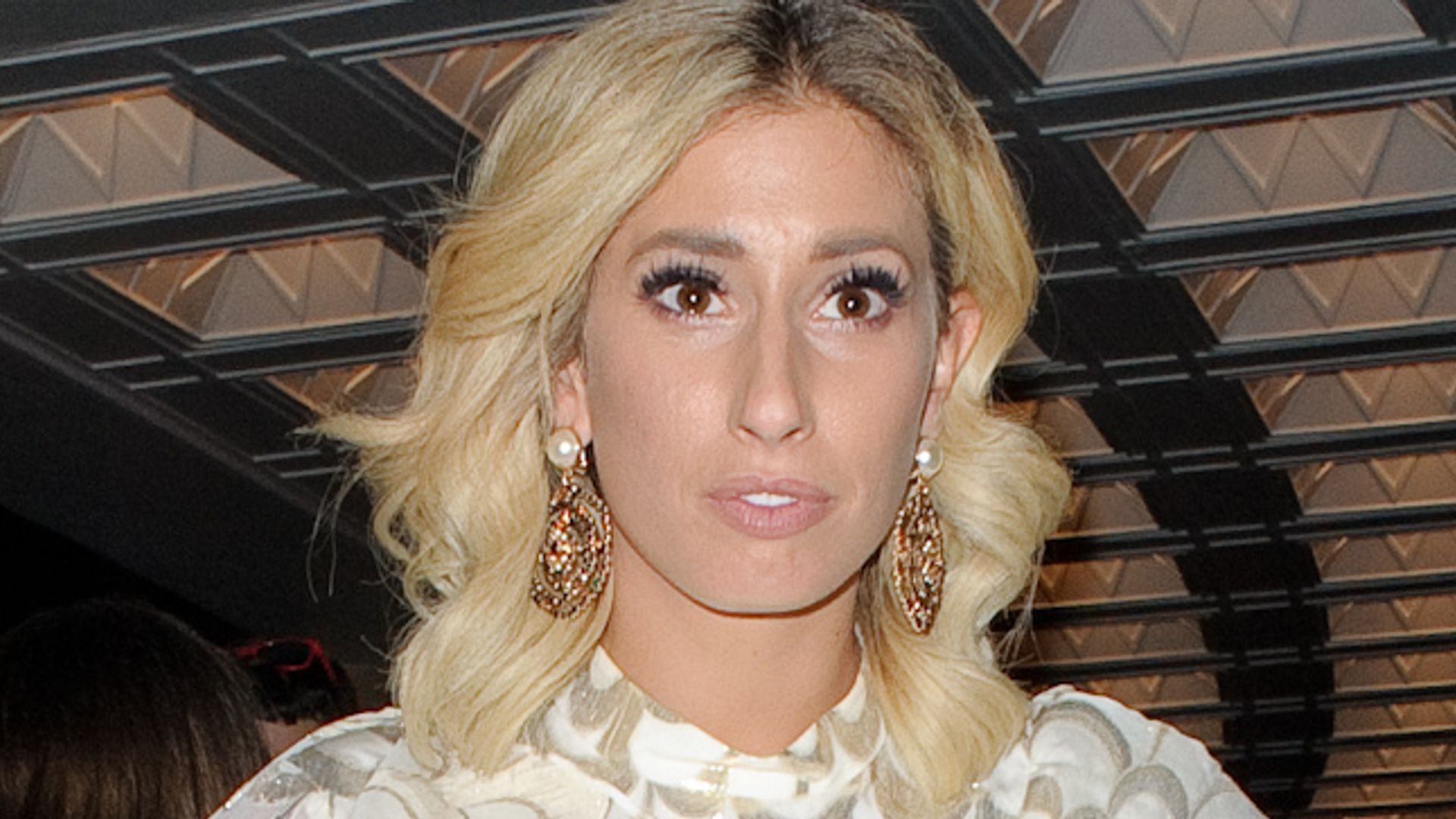 Stacey Solomon in a white dress and gold earrings at the TV Choice awards in 2017