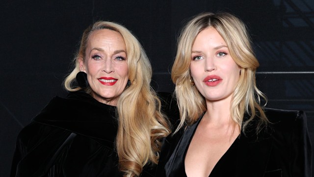 Model Jerry Hall and her daughter Georgia May Jagger smiling in black at Saint Laurent's SS24 show