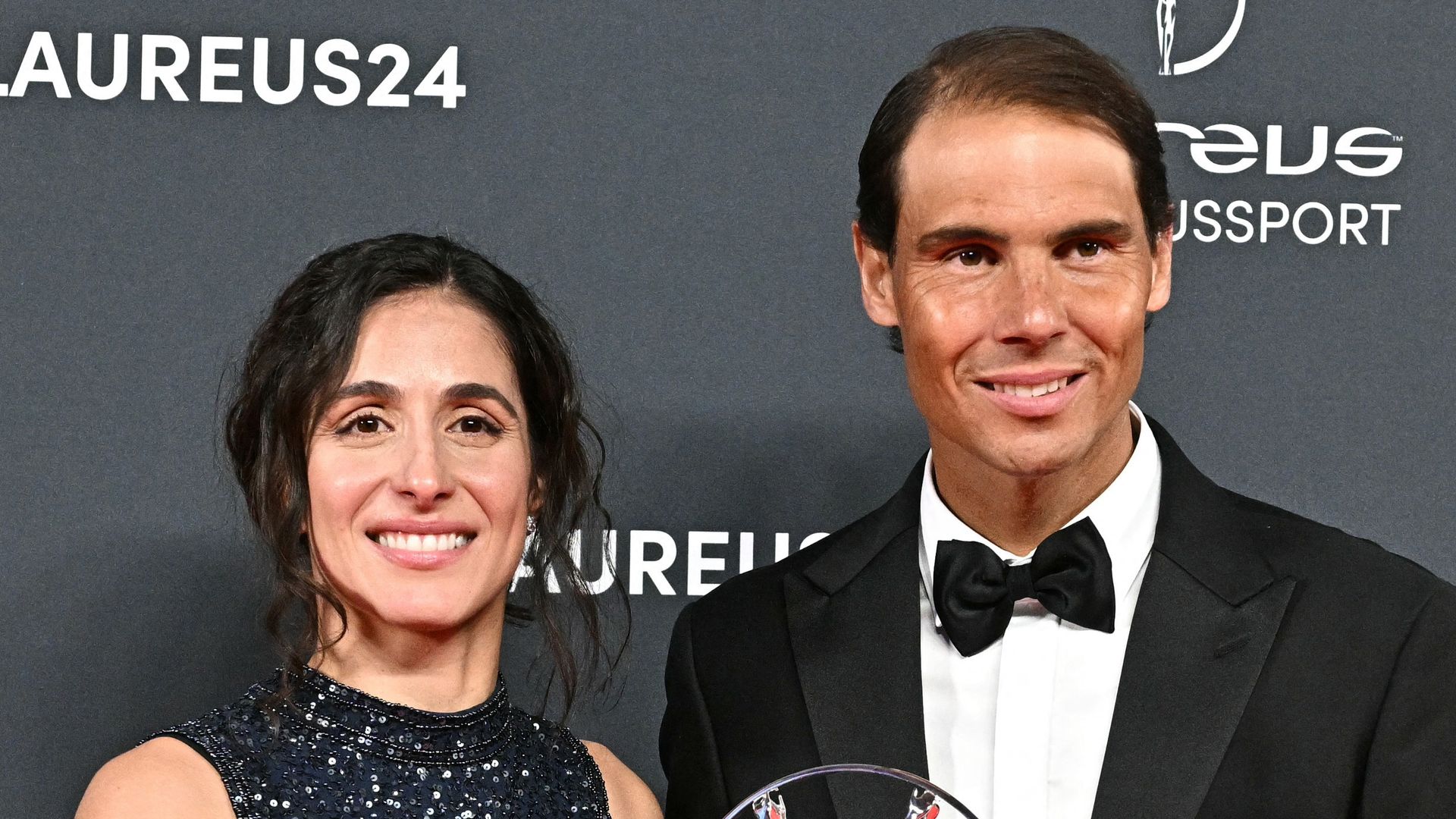 Spanish tennis player Rafa Nadal and his wife Xisca Perello (L) pose with the Laureus Sport for Good award received for the Rafa Nadal Foundation during the 25th Laureus World Sports Awards gala in Madrid on April 22, 2024.