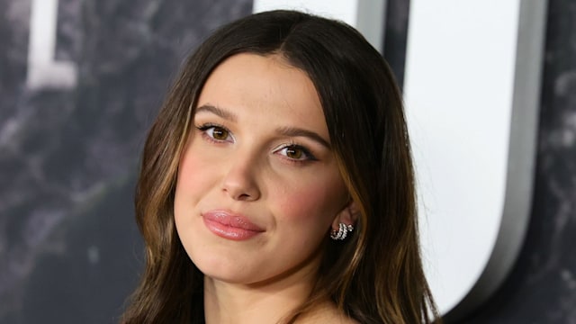 Millie Bobby Brown smiling on the red carpet 