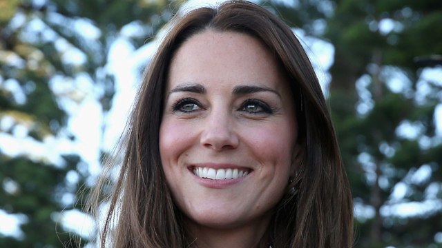 Kate Middleton waves as she leaves a lifesaving event on Manley Beach on April 18, 2014 in Sydney, Australia. The Duke and Duchess of Cambridge are on a three-week tour of Australia and New Zealand, the first official trip overseas with their son, Prince George of Cambridge.  