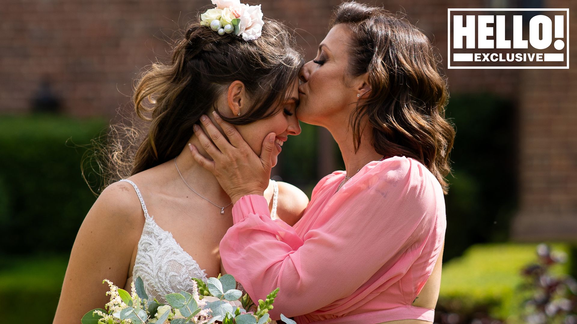 Kym Marsh kissing her daughter Emilie on the forehead on her wedding day